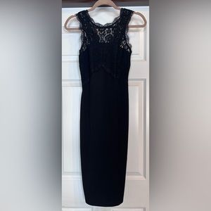 Gorgeous cocktail dress, midi length with lace detail at the top. Only worn once